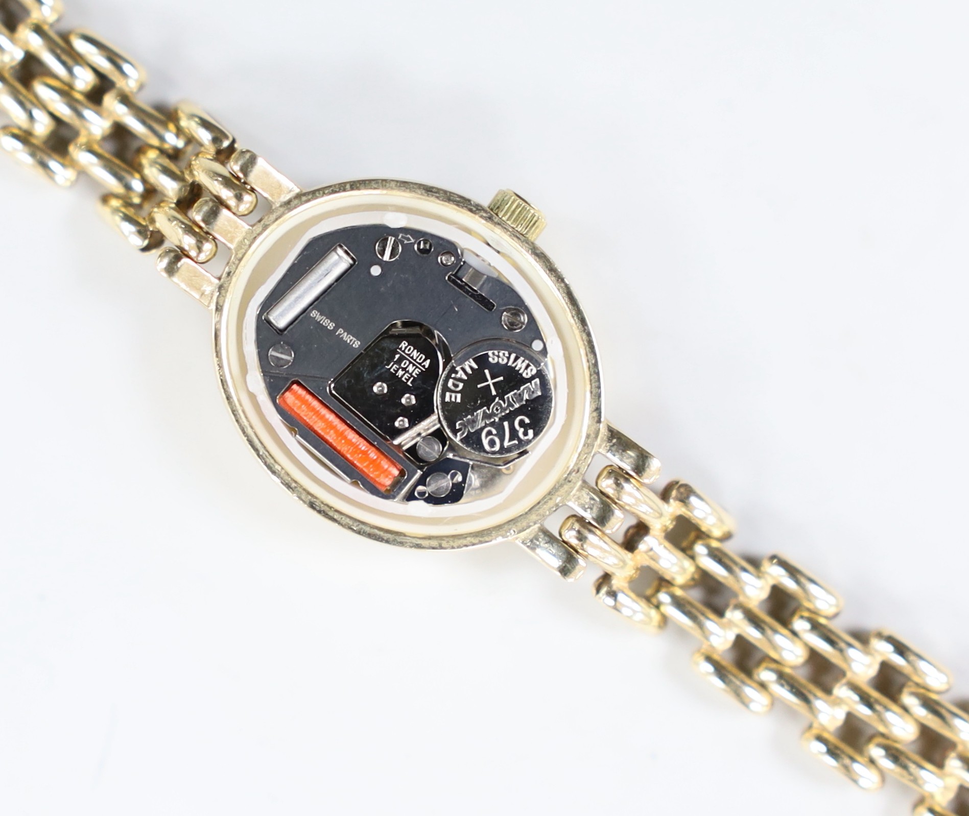 A lady's modern 9k Rotary Elite oval dial quartz wrist watch, on a 375 bracelet, overall 18cm, gross 15.4 grams.